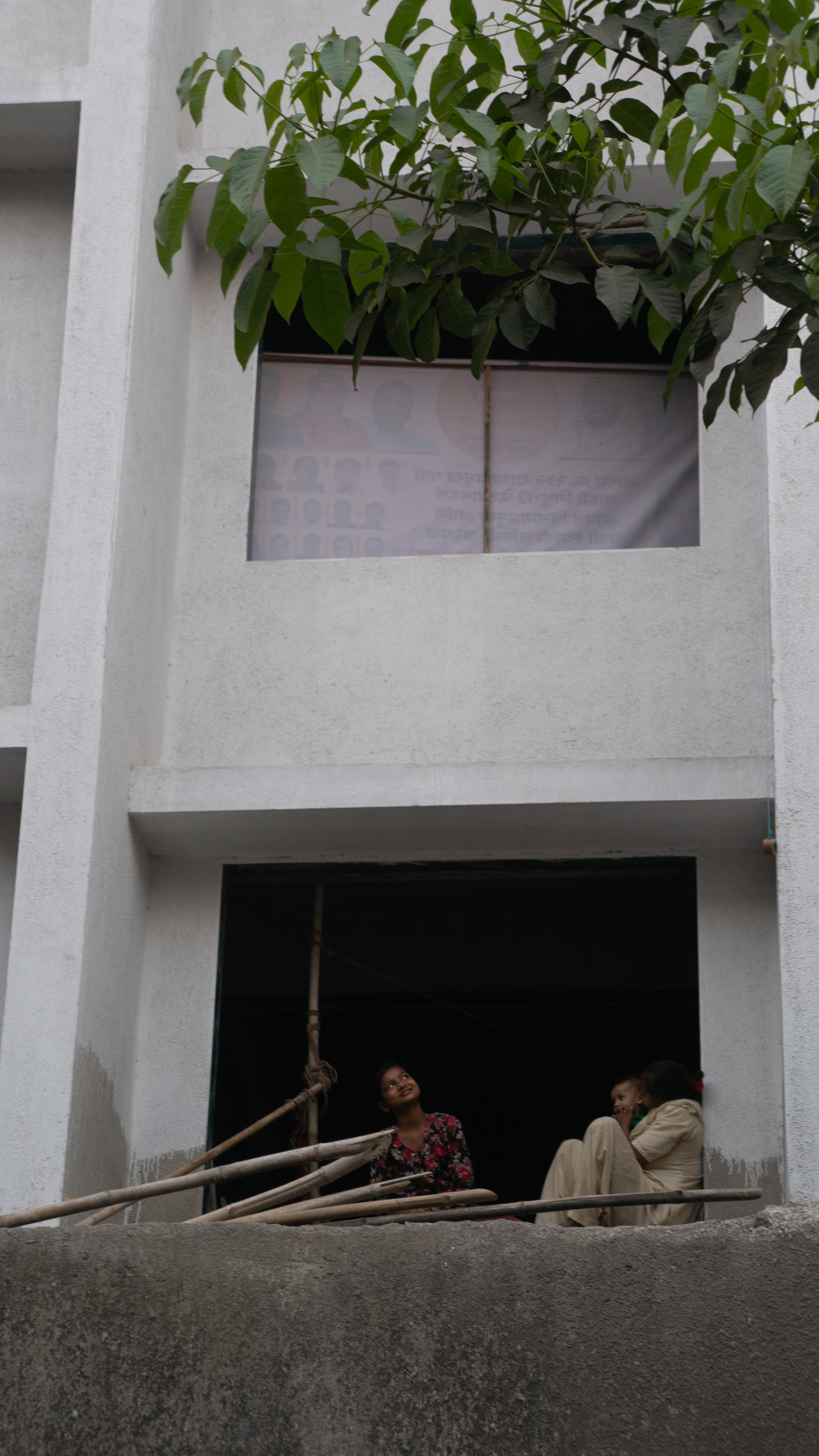 Family in window still in Mumbai