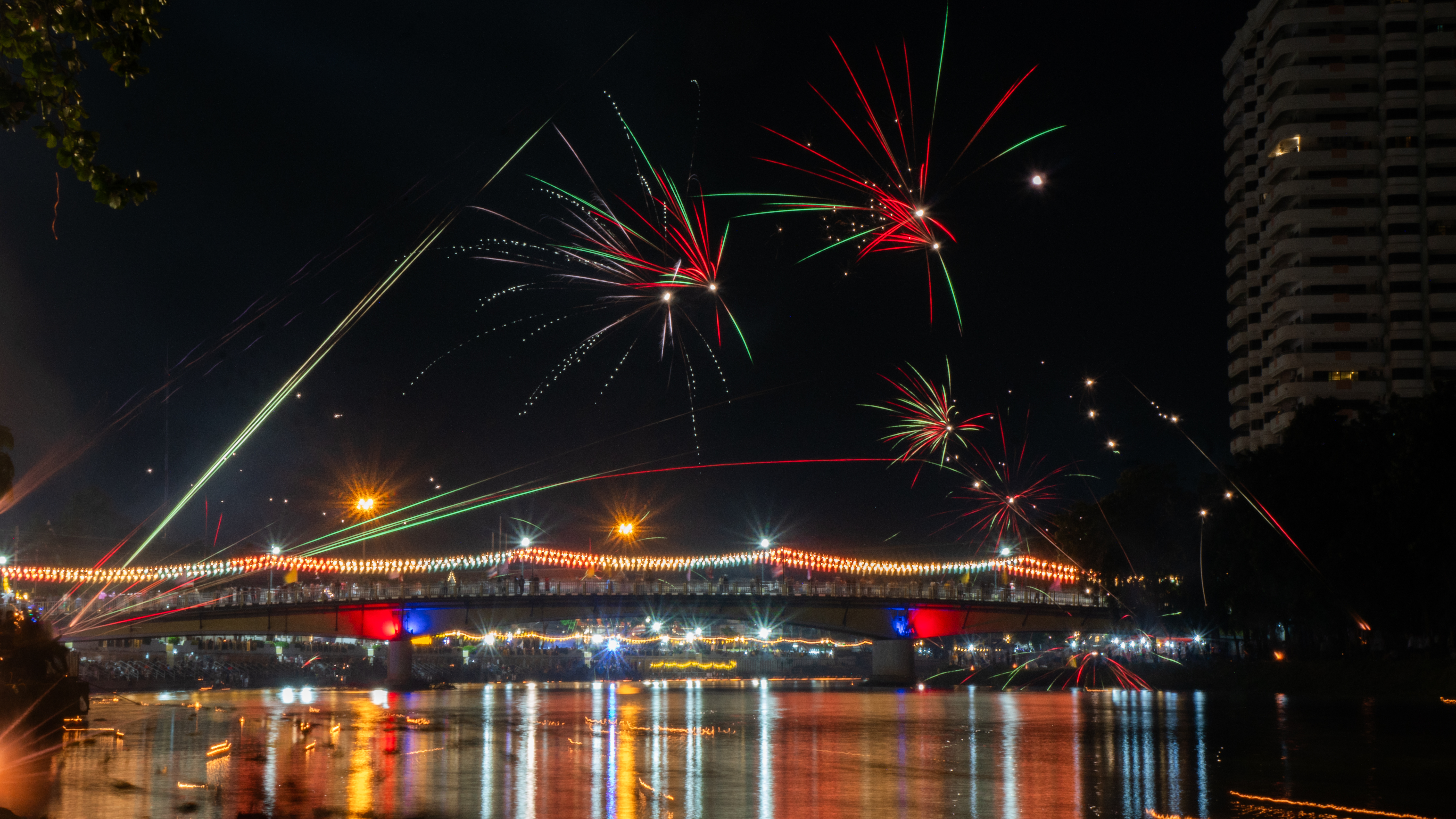 Fireworks over river in Thailand