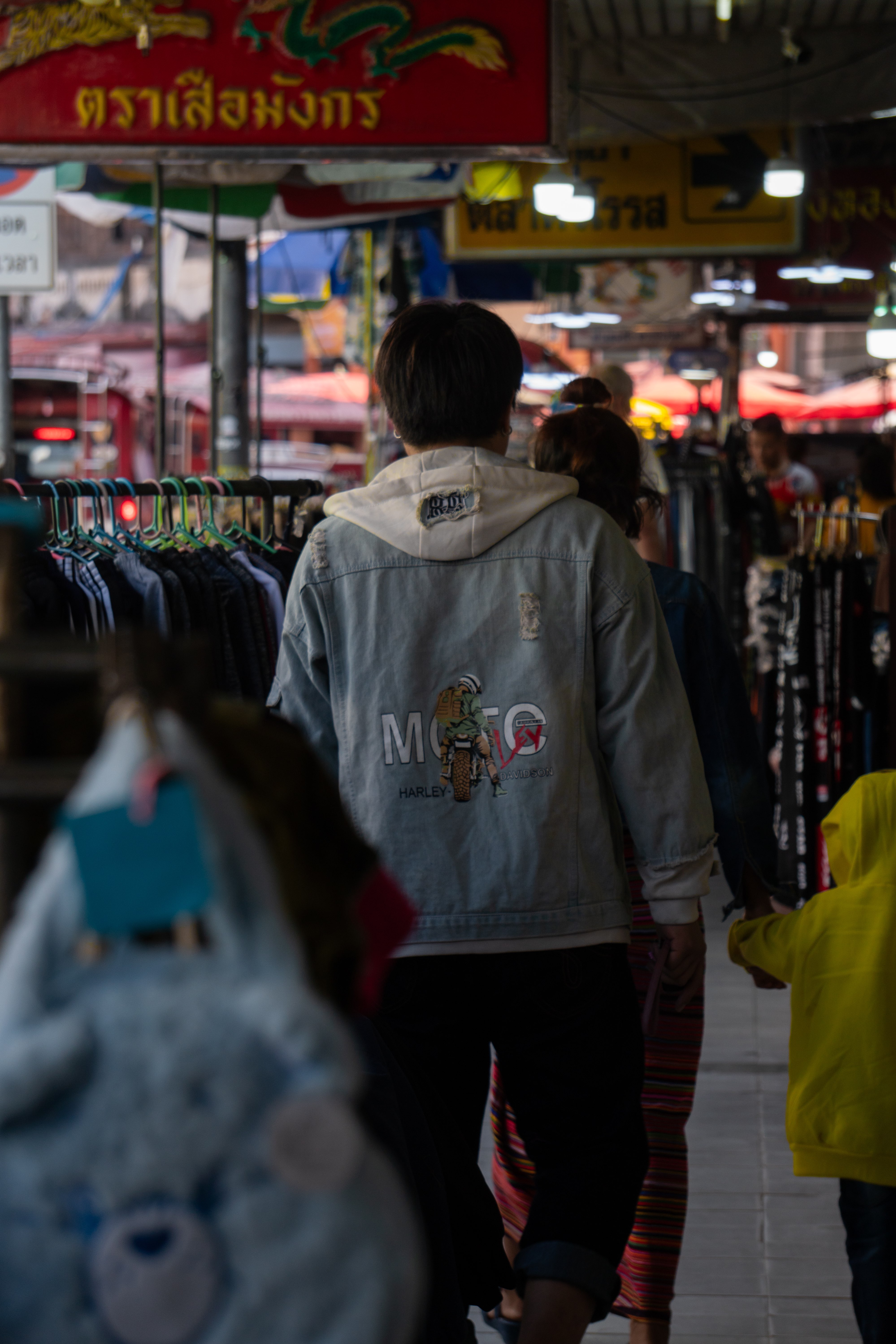 Man walking through market in Thailand