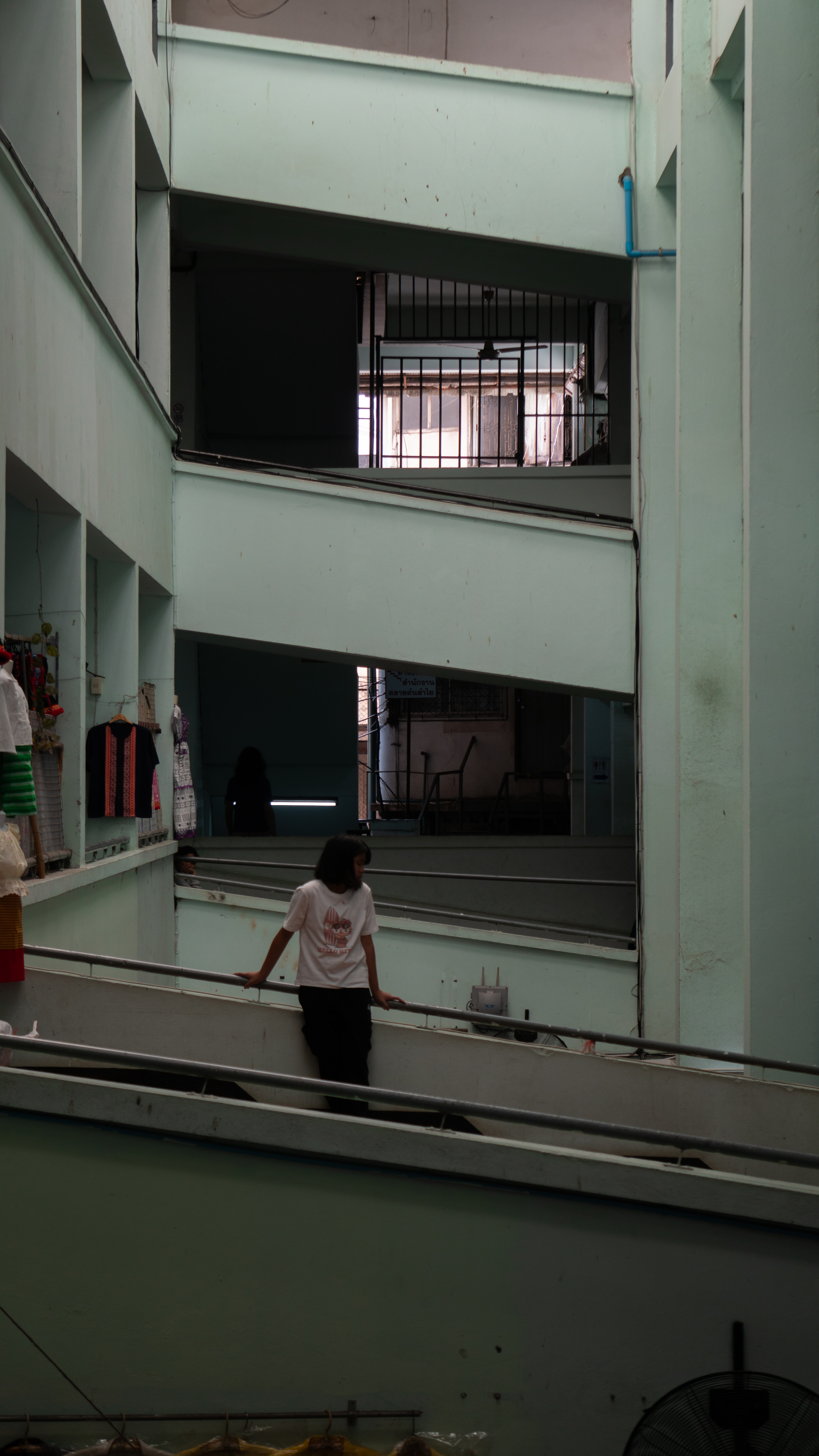 Girl standing in corridor in Thailand